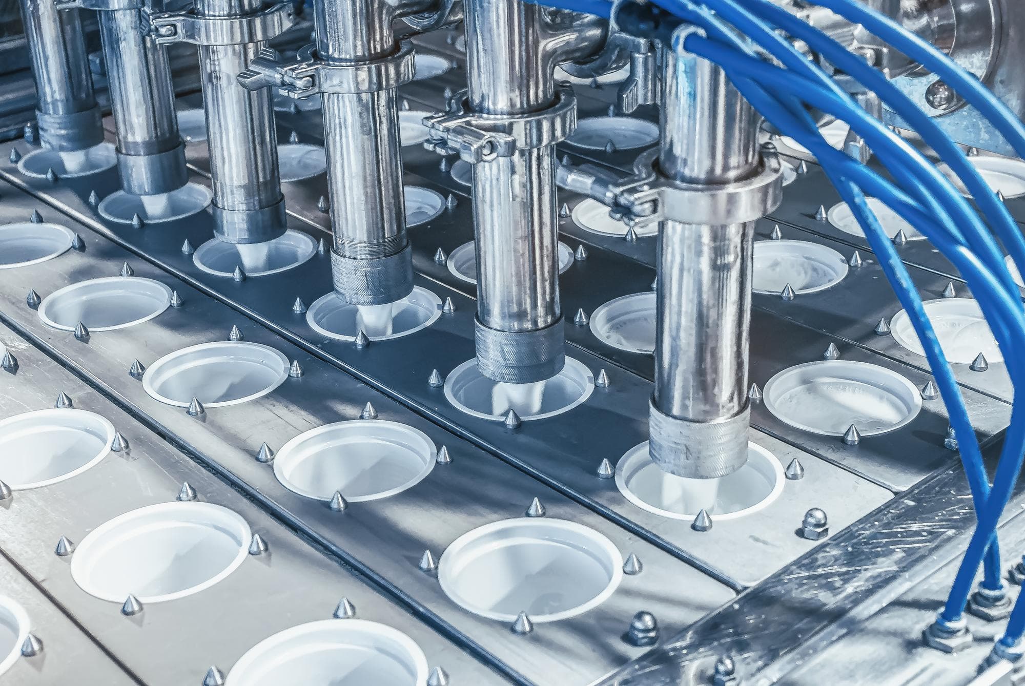 Dairy plant filling line — PP impact copolymer thinwall cups produced on high-MFI grades like SCGC P945J