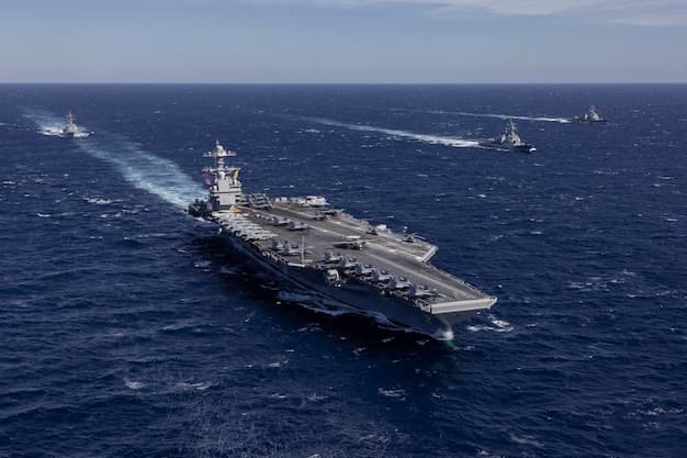 USS Gerald R. Ford aircraft carrier representing the US naval blockade of Iran during the 2026 Hormuz polymer supply crisis